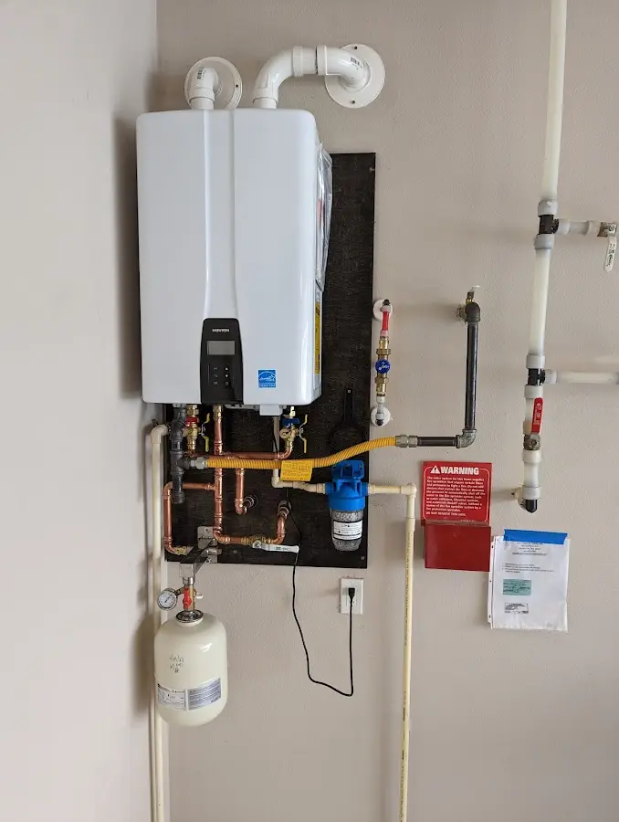 Professional plumber installing copper piping in a San Juan Capistrano home